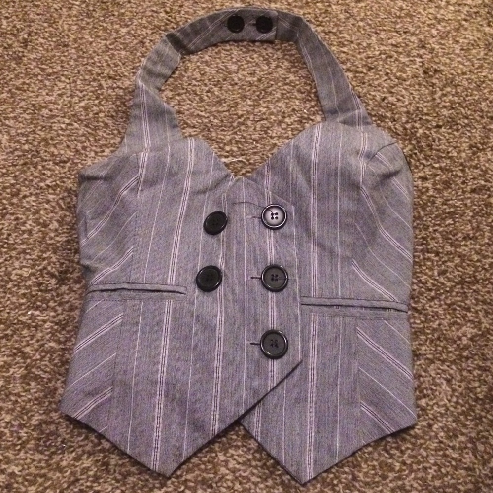 Grey pinstriped tie around vest
